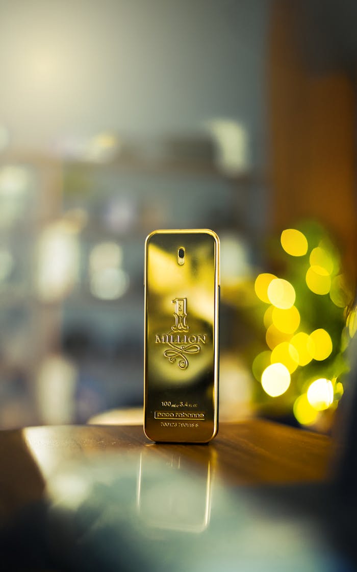 A gold perfume bottle with a luxurious design, capturing elegance and modern style.